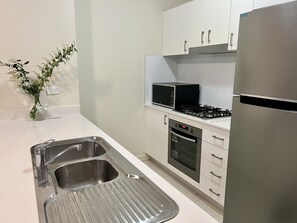 Fridge, microwave, oven, dishwasher - Modern two bedroom apartment next to Westmead hospital. (Westmead)