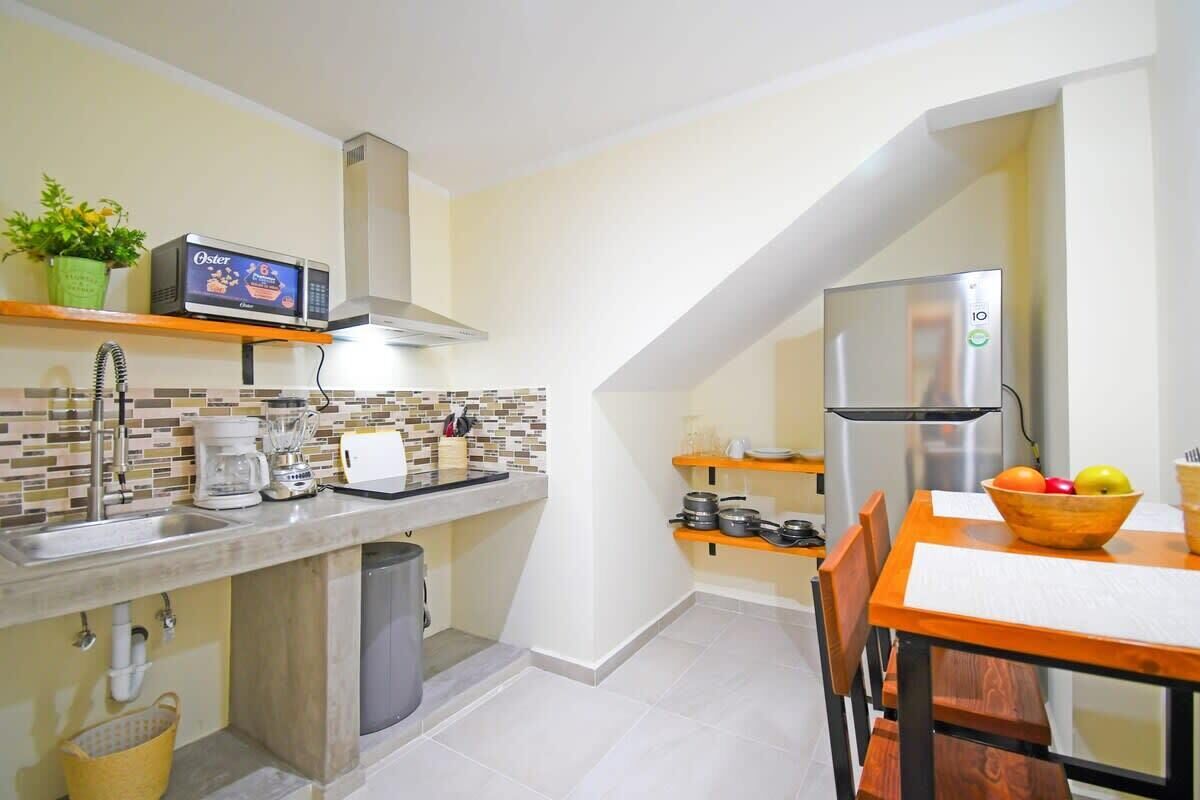 Fridge, microwave, stovetop, coffee/tea maker