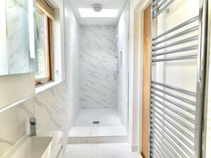 Shower, eco-friendly toiletries, hair dryer, towels