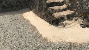 A stone staircase leading up a rugged, rocky wall. - The cave of benikulà ancient Pantelleria Dammuso Andrea 2 (Scauri)