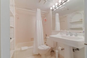Full bathroom with tub and vanity
