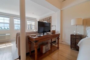 Studio view with TV and sleeping area