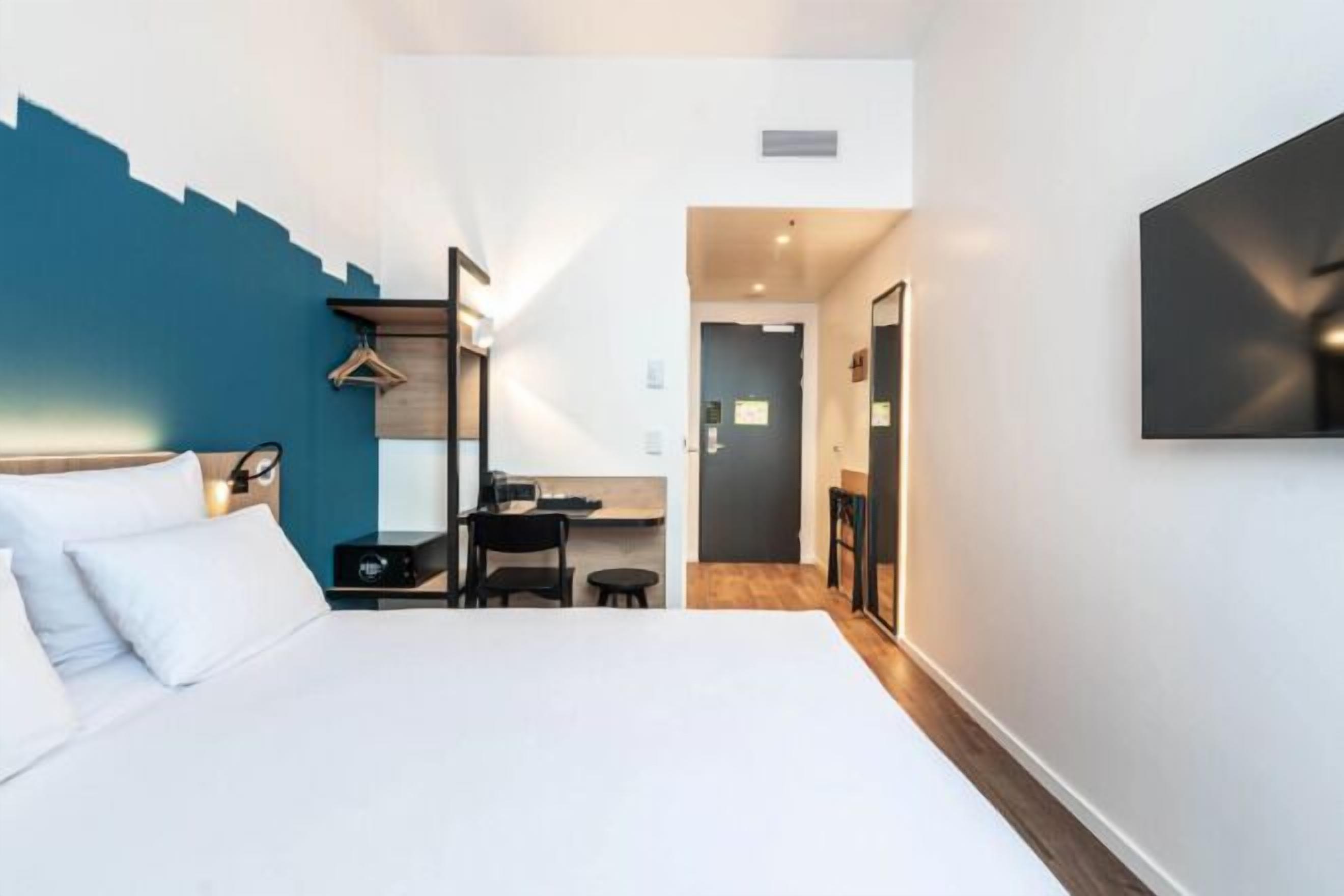 Premium bedding, desk, laptop workspace, free WiFi