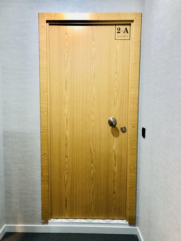 A wooden door with a sign indicating room number 2-A. - Downtown 2A in Oporto (Porto)