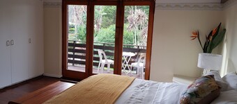 Beautiful double story house with ocean and mountain views. With pool + garden
