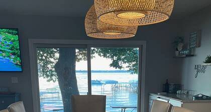 Enjoy this beach front lake home that boasts 66' of frontage with many amenities