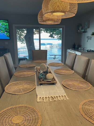 Enjoy this beach front lake home that boasts 66' of frontage with many amenities