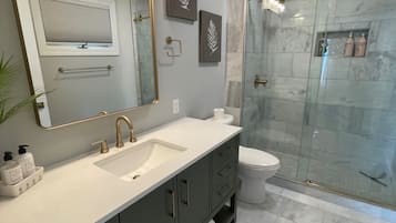 Combined shower/tub, hair dryer, towels, soap