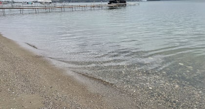 Enjoy this beach front lake home that boasts 66' of frontage with many amenities