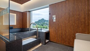 A modern bathroom with a large window, wooden paneling, and a built-in sink. - Wyndham Grand Zhaoqing Downtown (Zhaoqing)