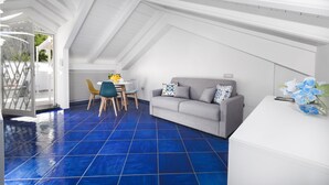 Leilighet – design | Oppholdsområde | En 42-tommers Flatskjerm-TV med digitale kanaler samt TV