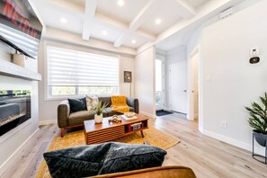 Smart TV, fireplace, books, offices