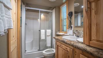 Shower, towels, soap, toilet paper