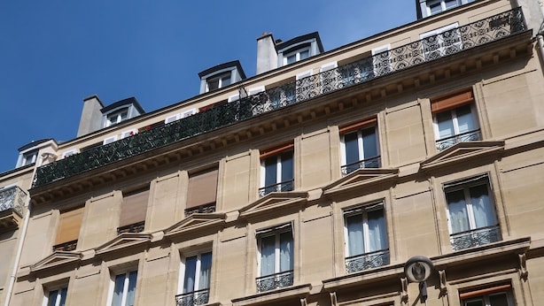 A multi-story building with a classic architectural style, featuring balconies with wrought iron railings and a series of windows. - Studio 10 m2 - Coeur Batignolles - Near Champs Elysées & Montmartre (Paris)