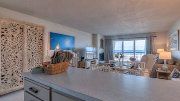 Deluxe Condo, Fireplace, Ocean View | Living area | Flat-screen TV, DVD player