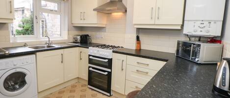 Fridge, electric kettle, toaster, cookware/dishes/utensils