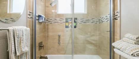 Combined shower/tub, hair dryer, towels, soap