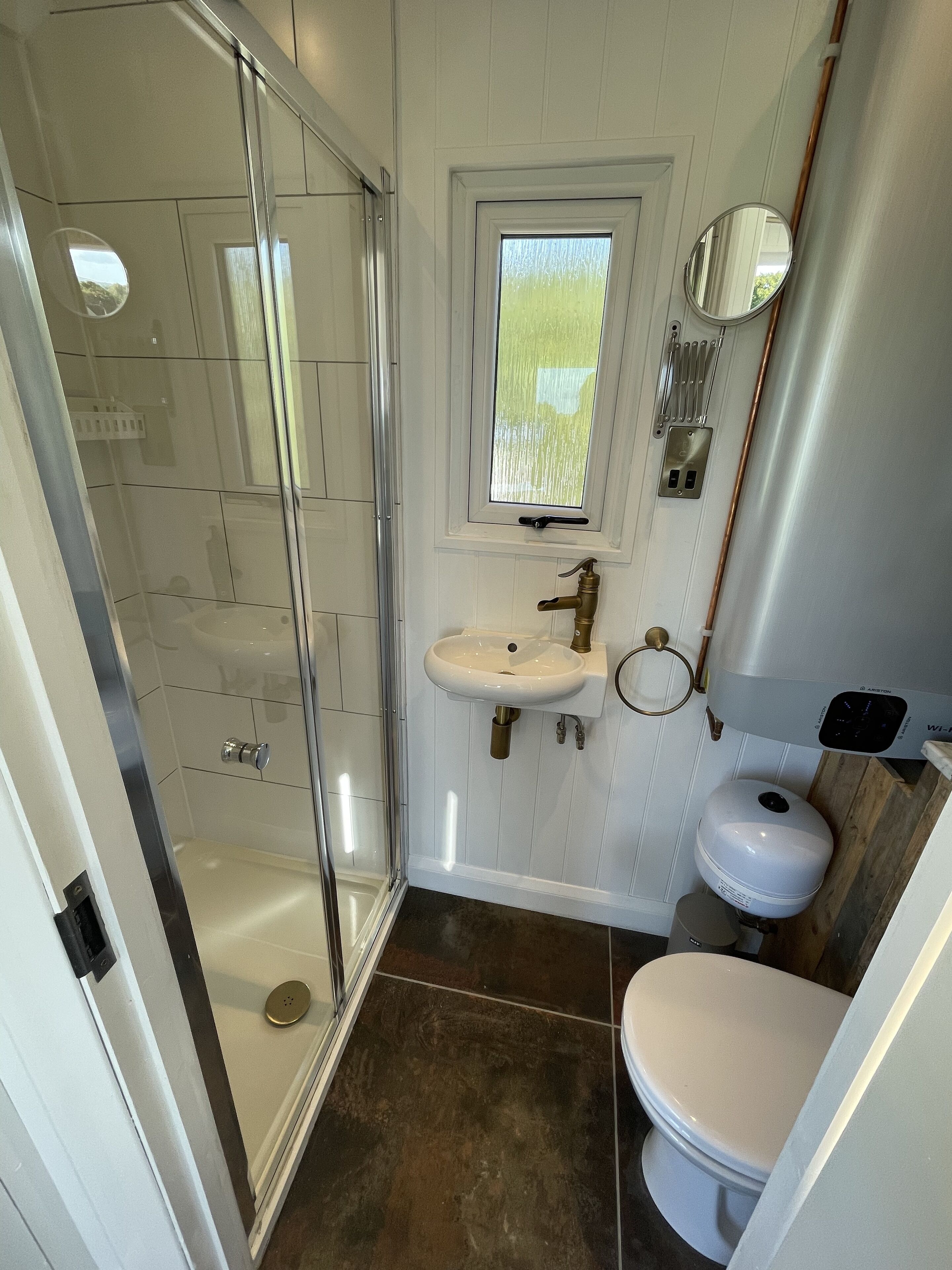 Shower, hair dryer, towels, toilet paper
