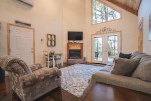 TV, fireplace - Cabin C at Safe Harbor Brady Mountain on Lake Ouachita! (Royal)