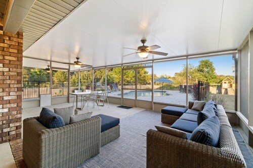 Single-level home with pool, enclosed yard, screened lanai, grill & home office