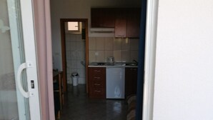A kitchen with a stove, sink, and cabinets. - Apartments Dijana - Superior Studio Apartment with Terrace (Viganj)