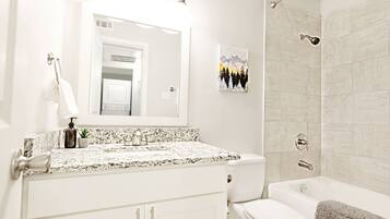 Combined shower/tub, hair dryer, towels, soap