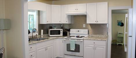 Fridge, microwave, stovetop, coffee/tea maker