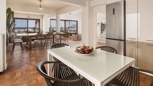 A spacious kitchen with a large island, modern appliances, and a view of the city. - Villa Anemeli | Infinity pool ,sea view close to the city, Elite Crete II (Kissamos)