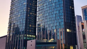Two high-rise buildings with reflective glass facades and a modern architectural design. - Le Méridien City Center, Doha (Doha)