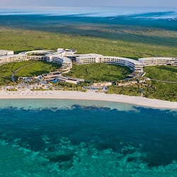 Experience the resort's unique circular design, with multiple levels of accommodation and expansive balconies offering breathtaking views of the ocean and surrounding landscape.