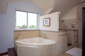Jetted tub, hair dryer, towels, soap