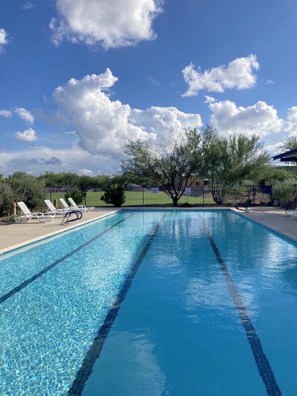 Relax by the pool with comfortable lounge chairs and a clear view of the surrounding area.