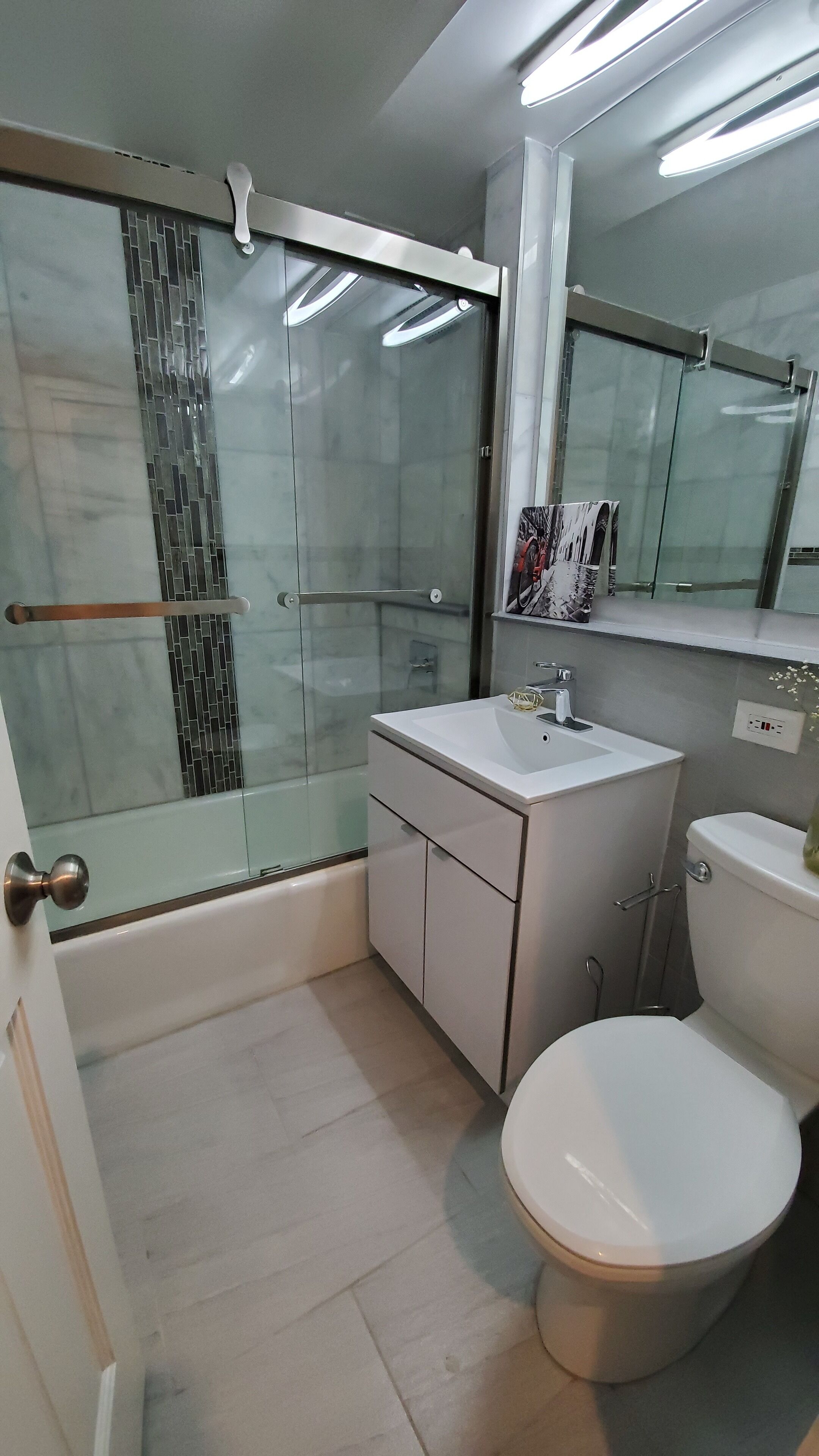 Combined shower/tub, hair dryer, towels, soap