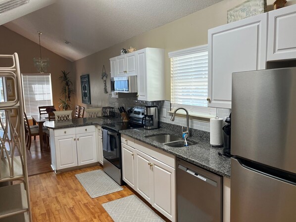 Fridge, microwave, oven, stovetop - Blue Heron Cottage – Walk to the Beach! Comfortable two bedroom / two full bath house in Ocean Lakes Family Campground. (Myrtle Beach)