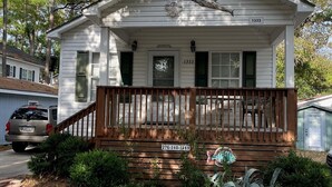 A white single-story house with a front porch, a mailbox, and a mailbox number 1333.