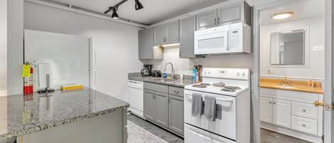 Coffee/tea maker, fridge, microwave, oven