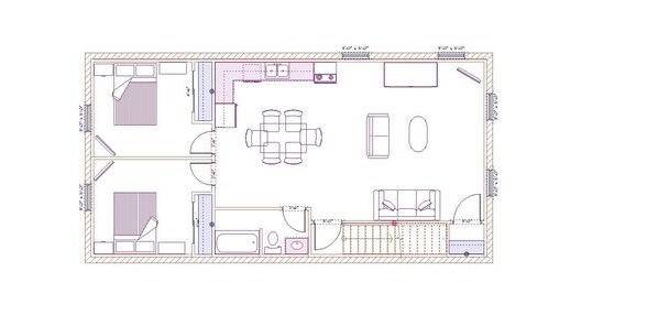 A floor plan of a hotel room with a bed, a desk, a chair, a small table, a sofa, and a bathroom.
