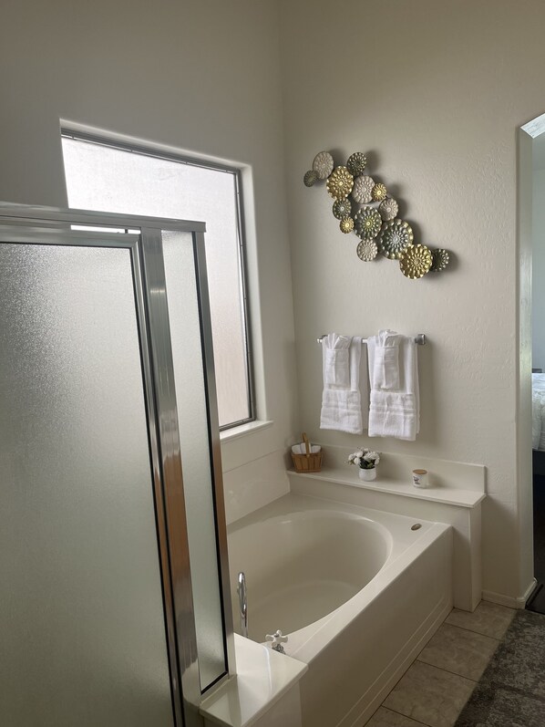 Combined shower/tub, hair dryer, towels, soap