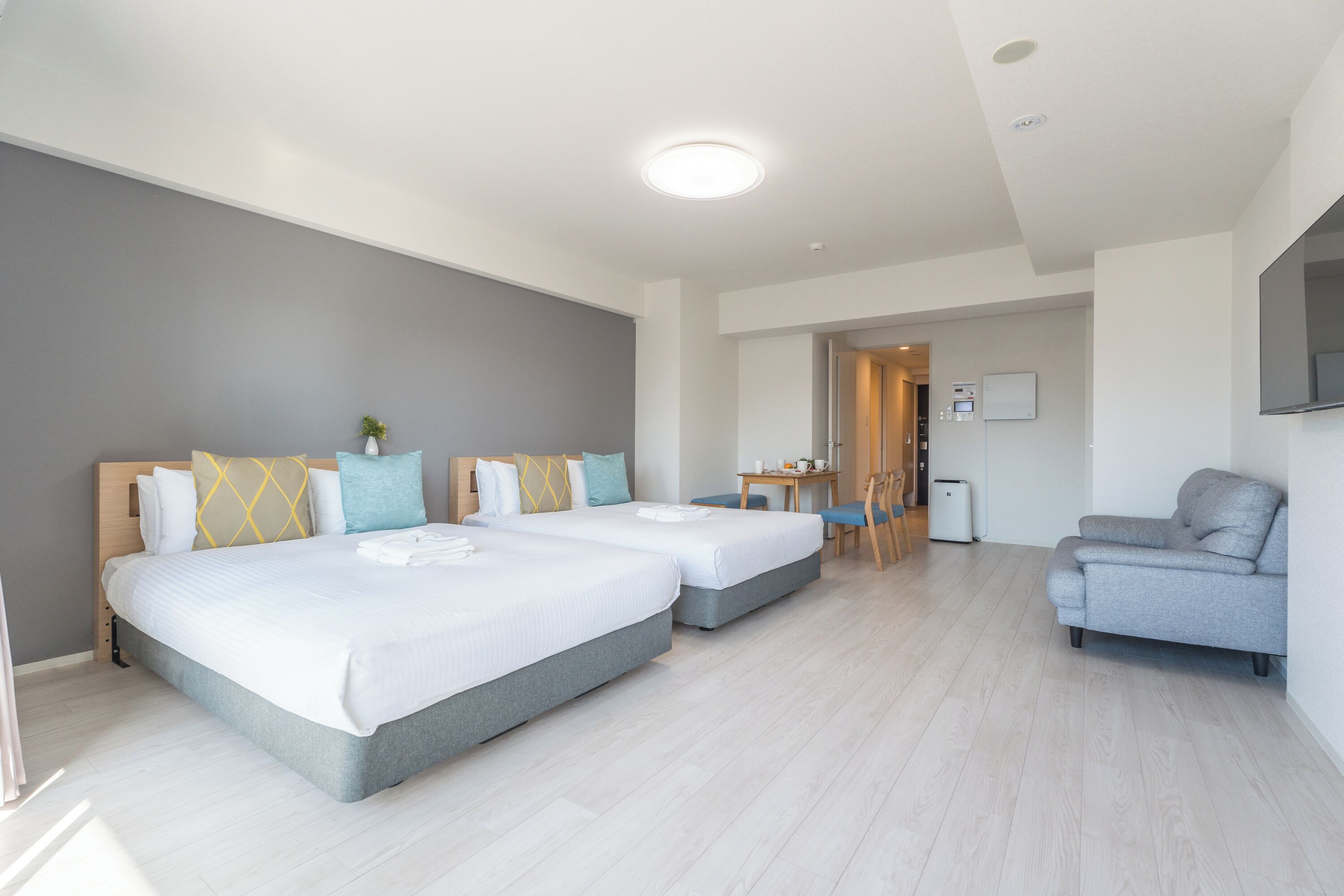 Exclusieve Twin kamer | Woonruimte | Een flatscreentelevisie