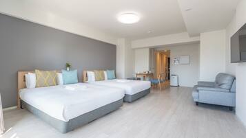 Exclusieve Twin kamer | Woonruimte | Een flatscreentelevisie