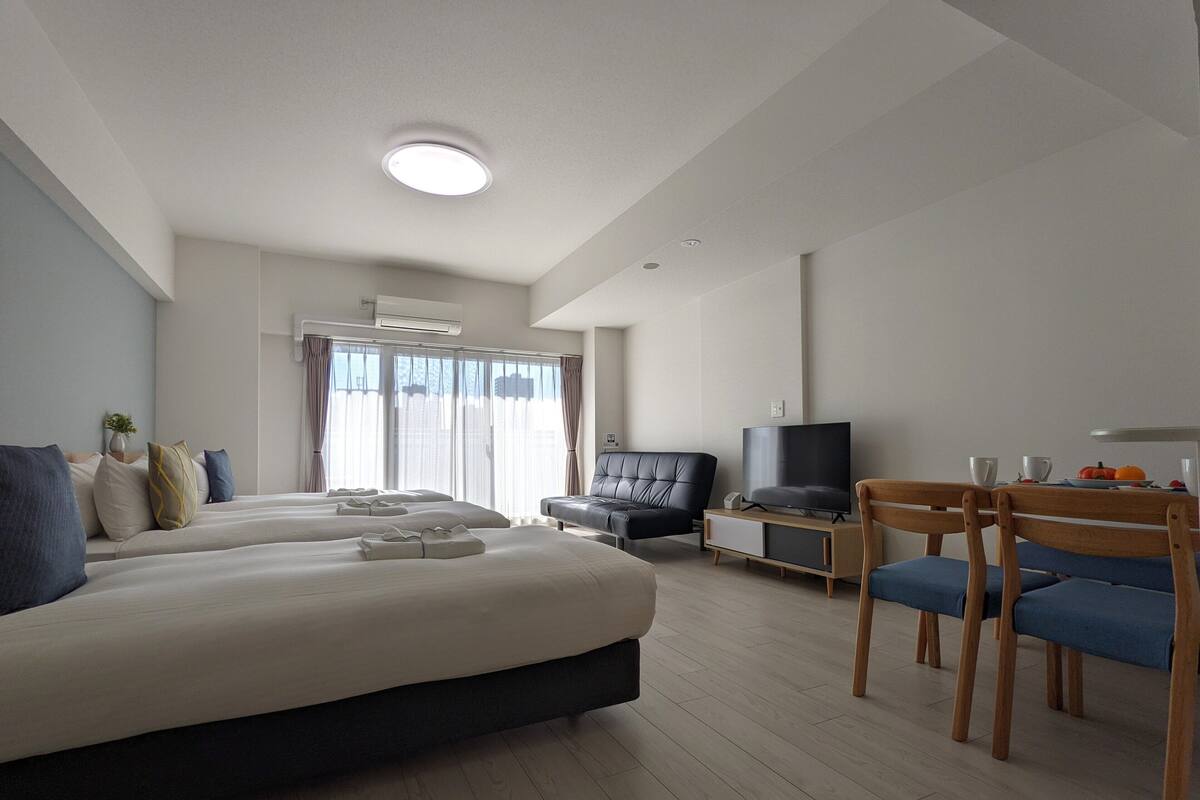 Classic Quadruple Room | Living room | Flat-screen TV
