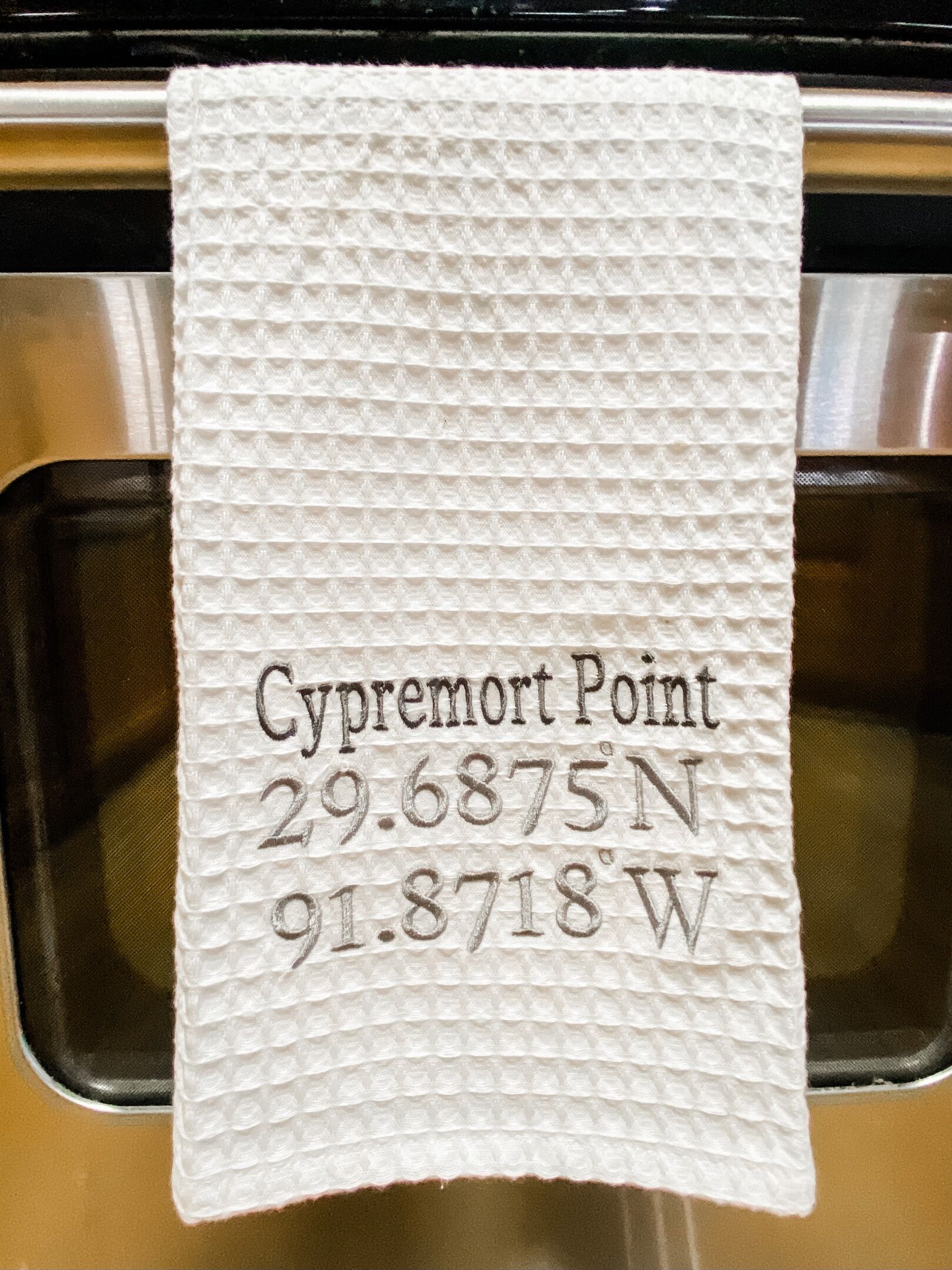A white paper towel with printed text and coordinates.