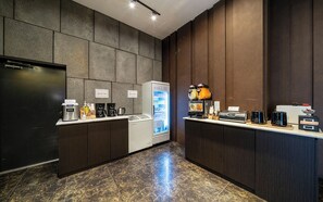 A self-service bar area with a refrigerator, coffee machines, and a beverage dispenser. - HOTEL CACAO (Incheon)