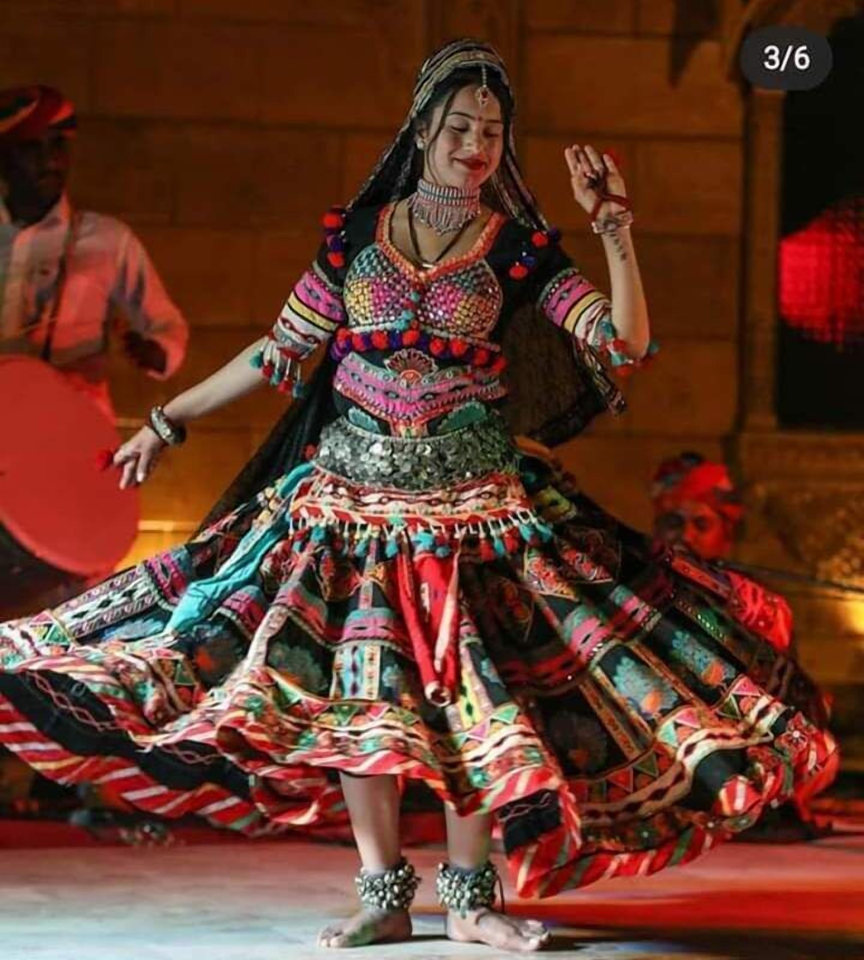 A person in traditional attire performing a dance.