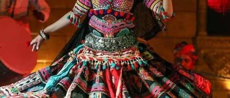 A person in traditional attire performing a dance.