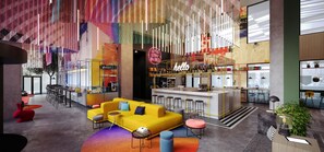 Un moderno hall de hotel con zona de bar, asientos y una paleta de colores vibrante.