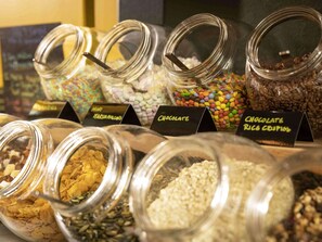 Indulge in a selection of sweet treats, including marshmallows, chocolate, and chocolate rice crisps.