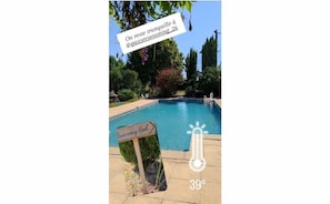 A swimming pool with a sign indicating it is a 'Swimming-Pool'.