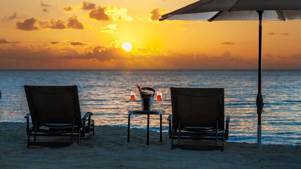 On the beach, sun-loungers, beach towels - Summer on Seven Mile Beach | Ocean View 2BR at Regal Beach Club (Seven Mile Beach)