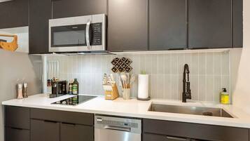 Microwave, stovetop, coffee/tea maker, cookware/dishes/utensils